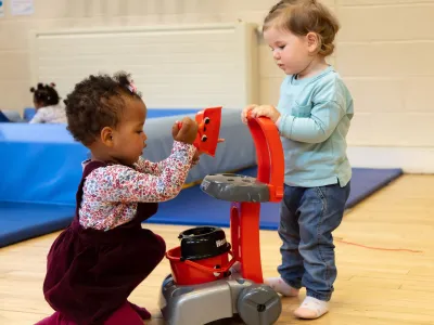Two toddlers playing at Children's Services drop-in